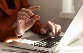 office manager male hands typing on laptop keyboard